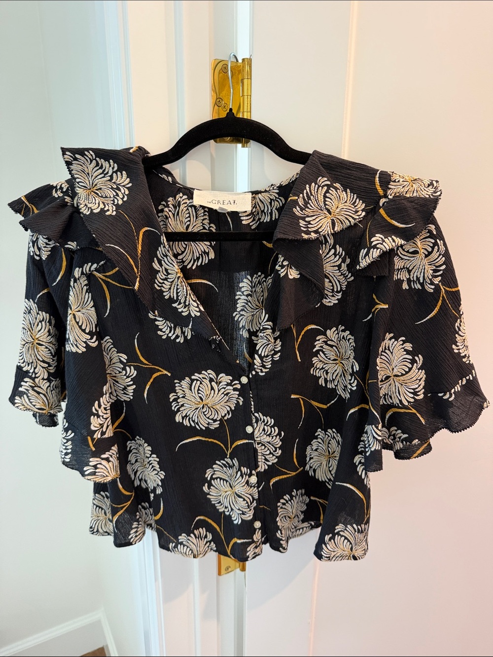 THE GREAT. Black Floral Ruffle Blouse — White & Gold Print